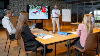 Impulsreferat mit Marco Büchel in einem Meetingraum